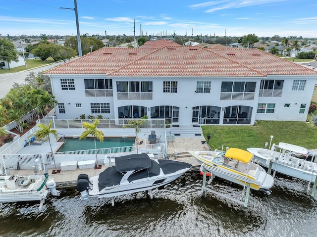 back of house featuring a water view