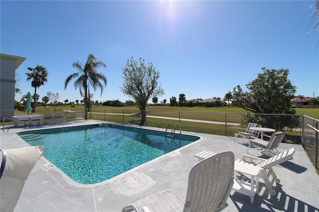 view of pool featuring a patio