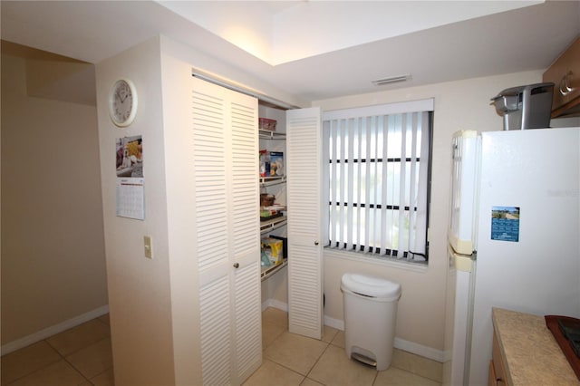 bathroom with tile patterned flooring