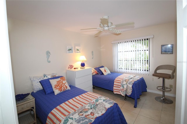 bedroom featuring light tile patterned floors and ceiling fan