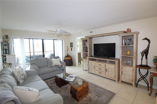 living room with light tile patterned flooring and ceiling fan