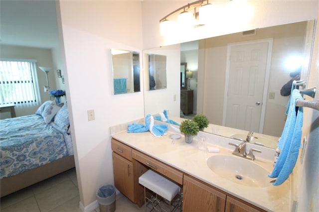 bathroom with tile patterned floors and vanity