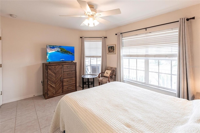 bedroom with light tile patterned floors and ceiling fan