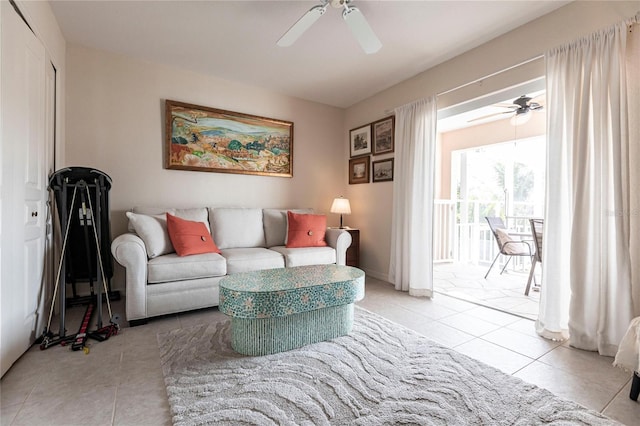 tiled living room with ceiling fan