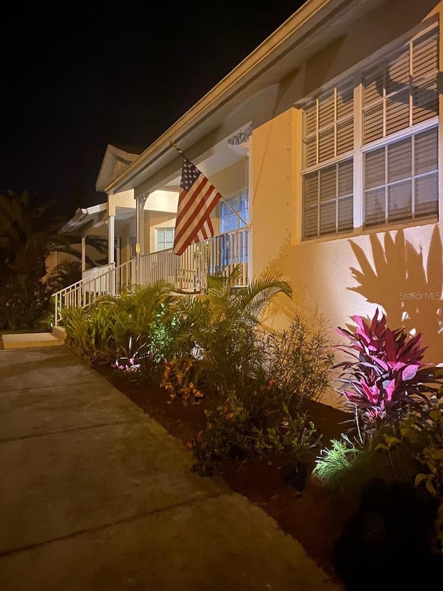 view of property exterior at night