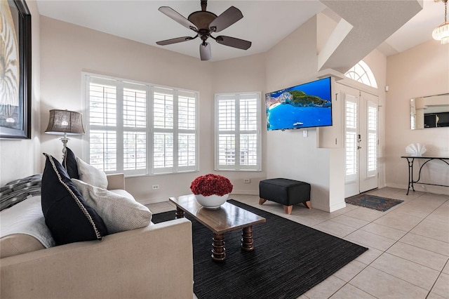 tiled living room featuring ceiling fan