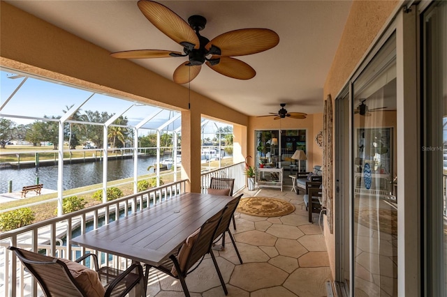 sunroom with a water view