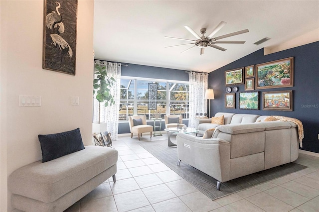 tiled living room featuring lofted ceiling and ceiling fan