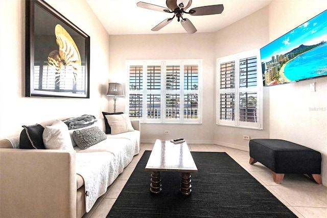 tiled living room with ceiling fan