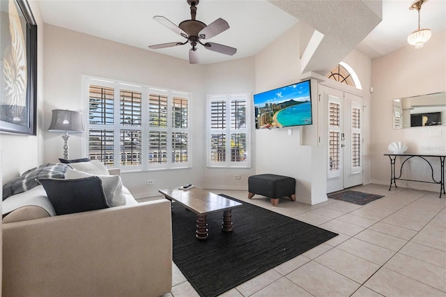 tiled living room featuring ceiling fan