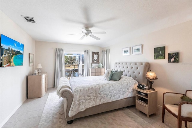 bedroom featuring a textured ceiling, access to exterior, ceiling fan, and light tile patterned floors