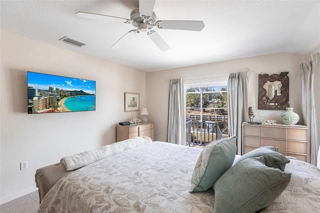 bedroom featuring access to exterior, a textured ceiling, ceiling fan, and light tile patterned flooring