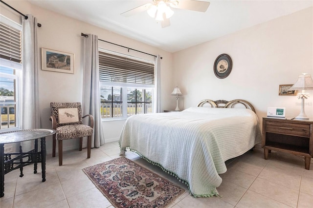 bedroom with light tile patterned flooring and ceiling fan