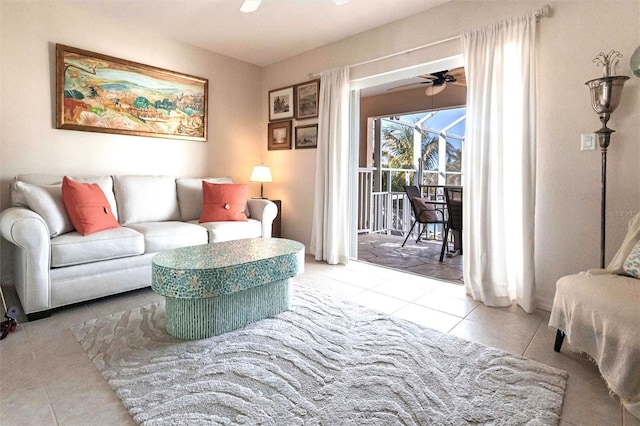 living room with ceiling fan and light tile patterned floors