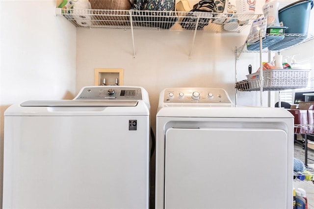 washroom featuring independent washer and dryer