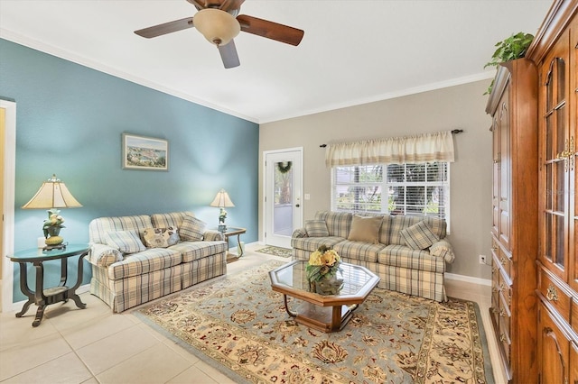 living room with crown molding, ceiling fan, and light tile patterned floors