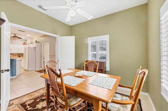 dining area featuring light tile patterned flooring and ceiling fan