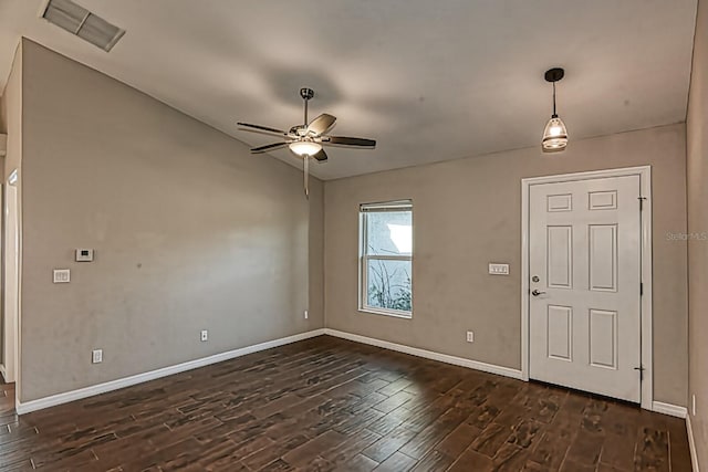 foyer entrance featuring vaulted ceiling, dark wood-type flooring, and ceiling fan