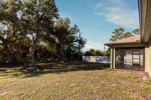 view of yard featuring a sunroom