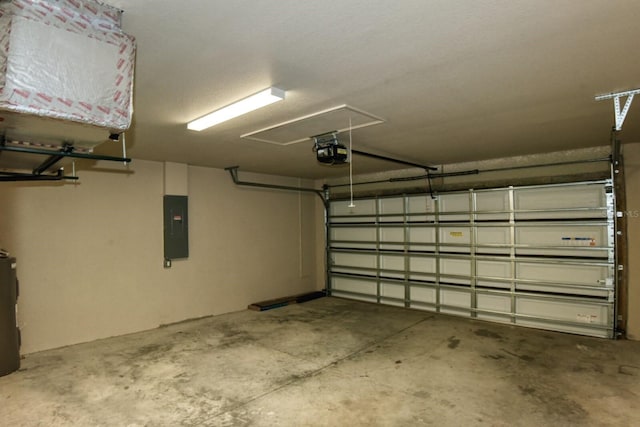 garage featuring a garage door opener and electric panel