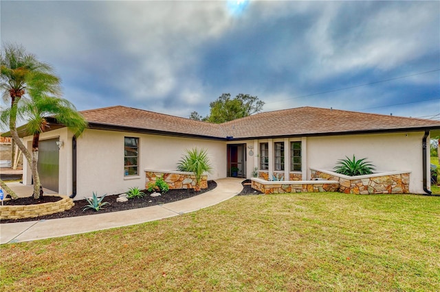 single story home with a front yard