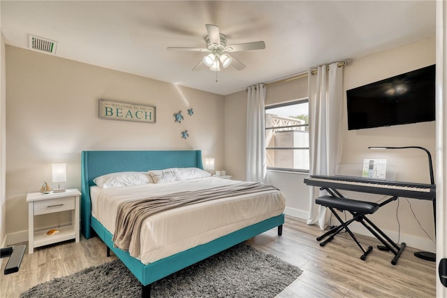 bedroom featuring wood-type flooring and ceiling fan