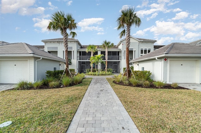 view of front property with a garage and a front lawn