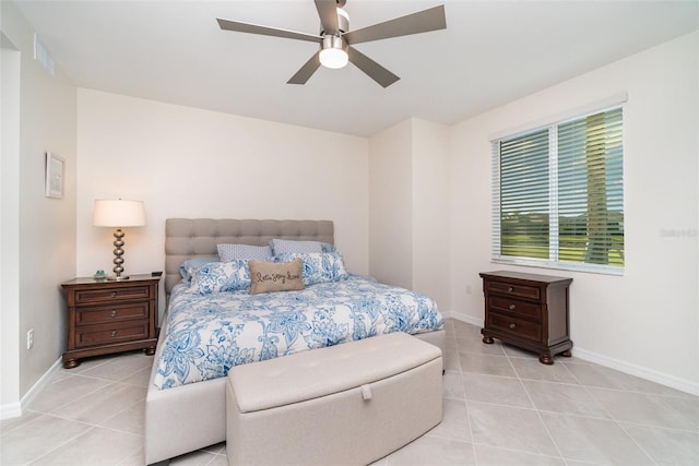 tiled bedroom with ceiling fan