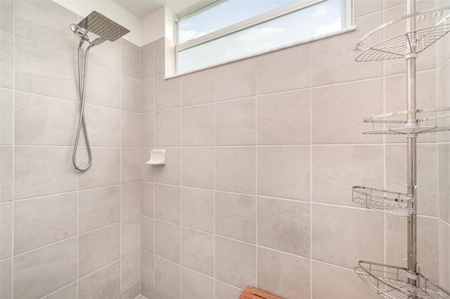 bathroom with tiled shower