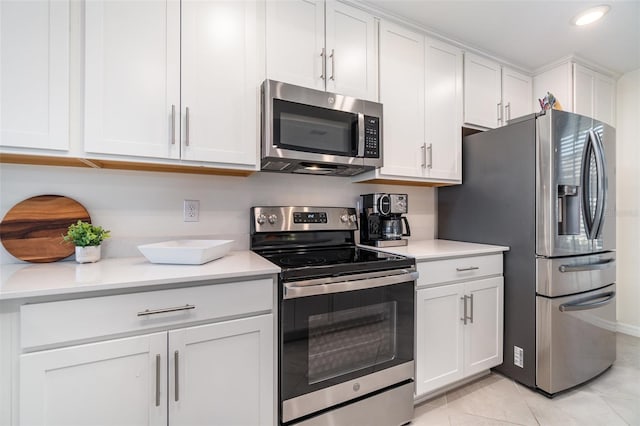 kitchen featuring white cabinetry, appliances with stainless steel finishes, and light tile patterned flooring