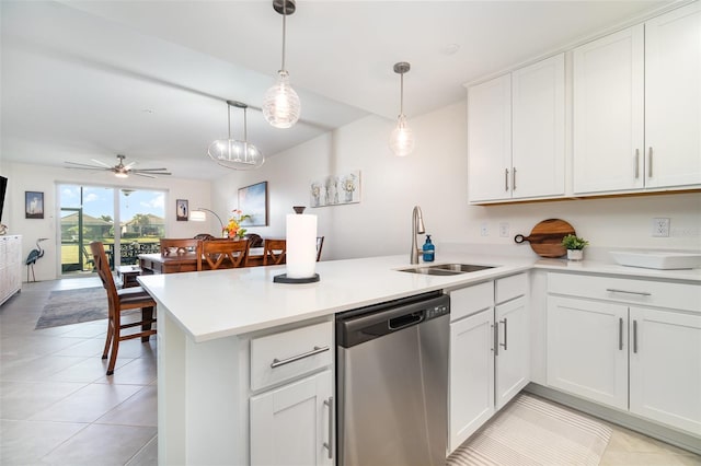 kitchen with pendant lighting, dishwasher, kitchen peninsula, and white cabinets