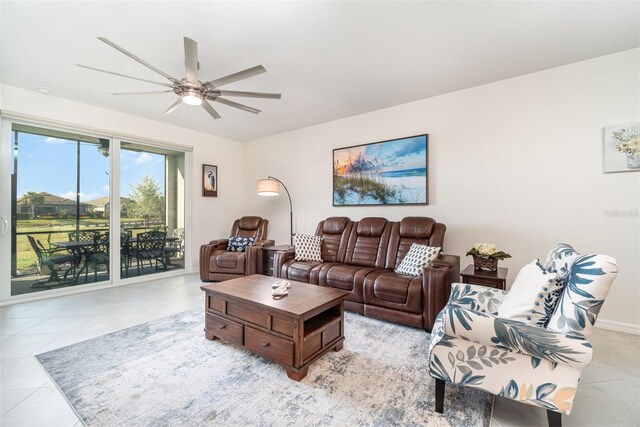 tiled living room with ceiling fan