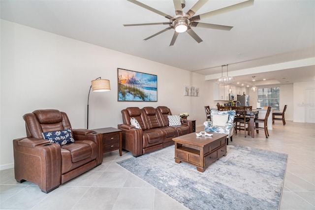 living room with light tile patterned floors and ceiling fan