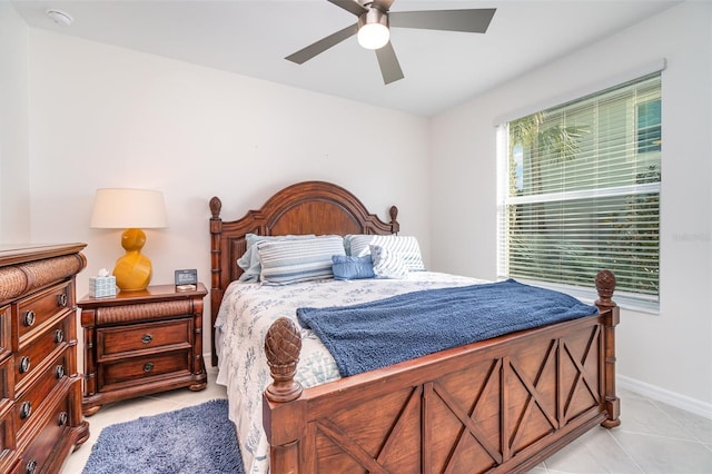 tiled bedroom with ceiling fan