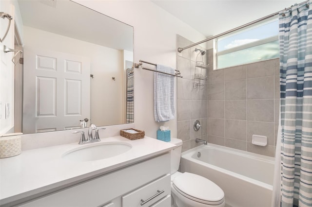 full bathroom featuring vanity, toilet, and shower / tub combo with curtain