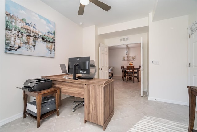 tiled office space featuring ceiling fan