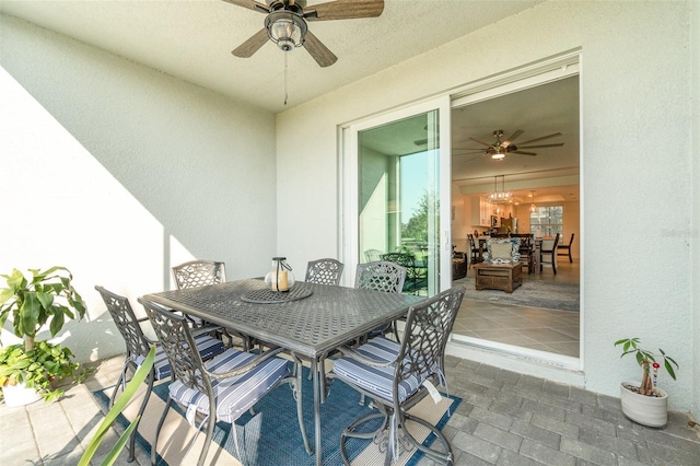 view of patio featuring ceiling fan