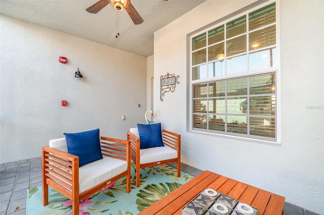 view of patio / terrace featuring ceiling fan