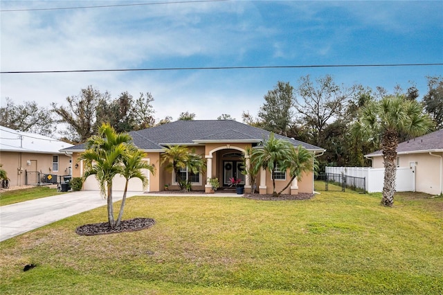 view of front of house with a garage and a front lawn