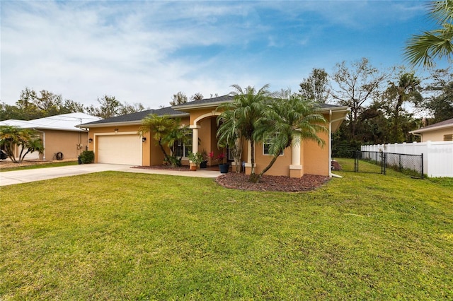 view of front of house with a garage and a front lawn