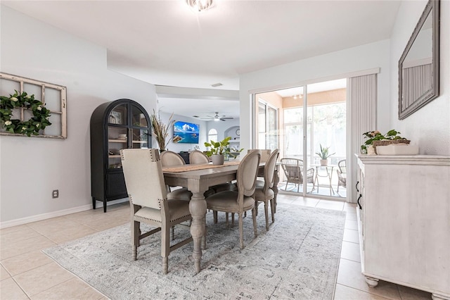 tiled dining room featuring ceiling fan