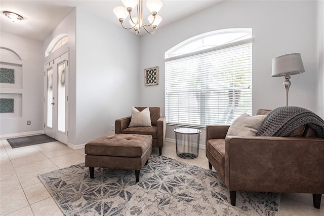 sitting room featuring an inviting chandelier and light tile patterned flooring