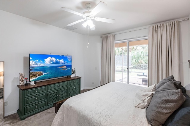 carpeted bedroom with ceiling fan and access to outside