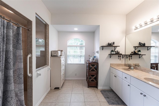 bathroom featuring vanity, a shower with shower curtain, and tile patterned flooring