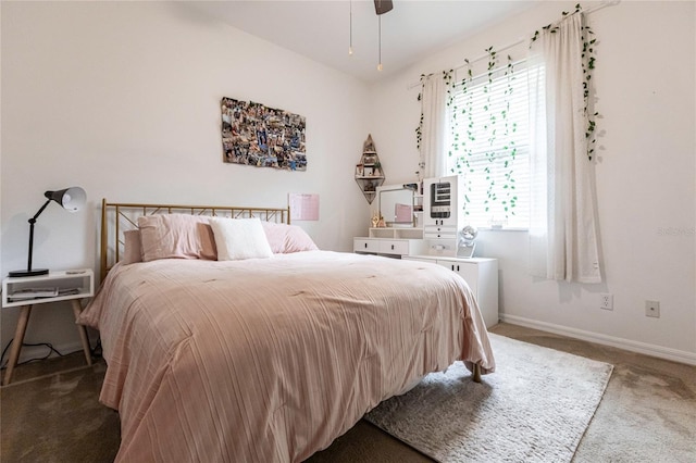 bedroom featuring ceiling fan and carpet