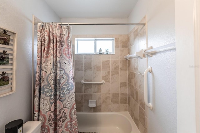 bathroom with toilet and shower / bath combination with curtain