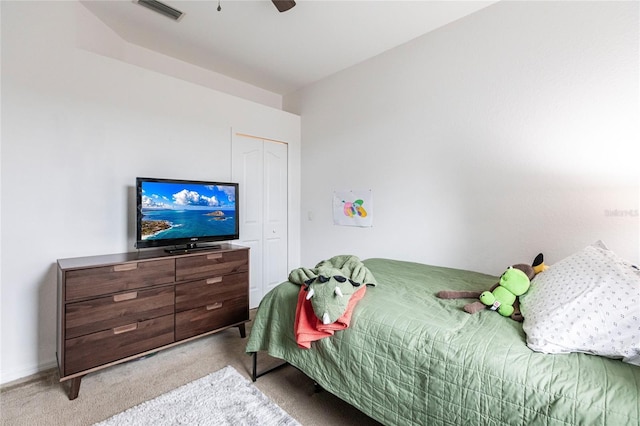 carpeted bedroom with a closet and ceiling fan