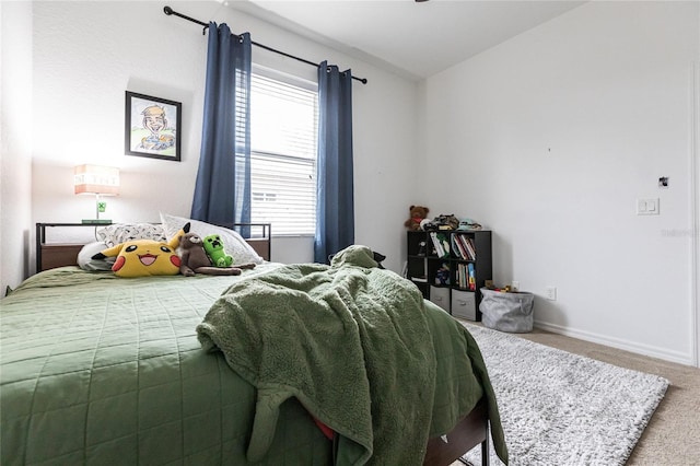 bedroom with multiple windows and carpet flooring