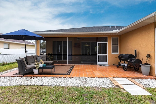 back of house featuring a patio area, outdoor lounge area, and a sunroom