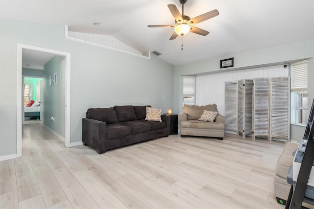 living room with lofted ceiling, light wood-type flooring, and ceiling fan